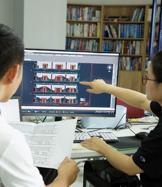 Our technicians are discussing the design plan.
